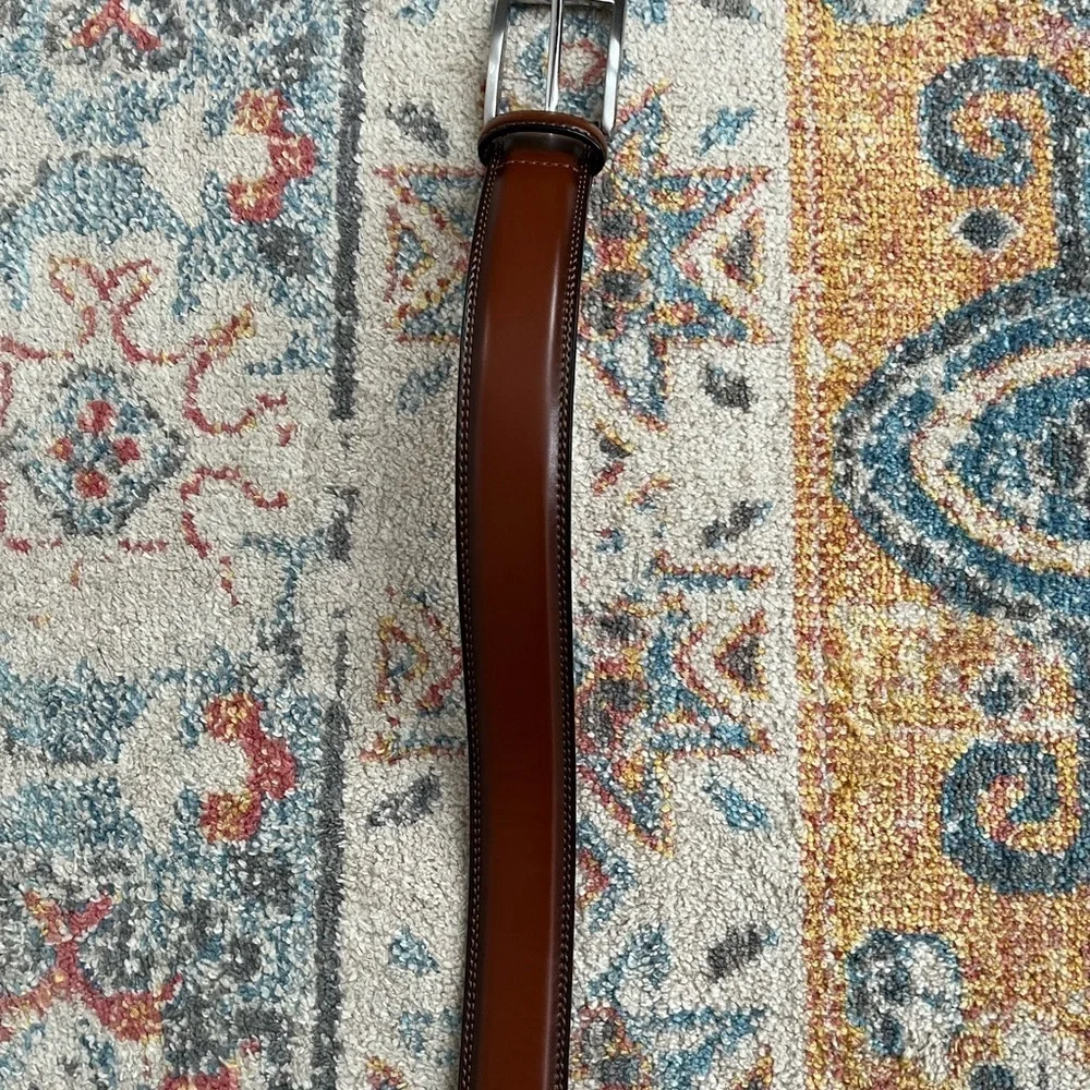 Beautiful brown belt with silver buckle. New, never worn.